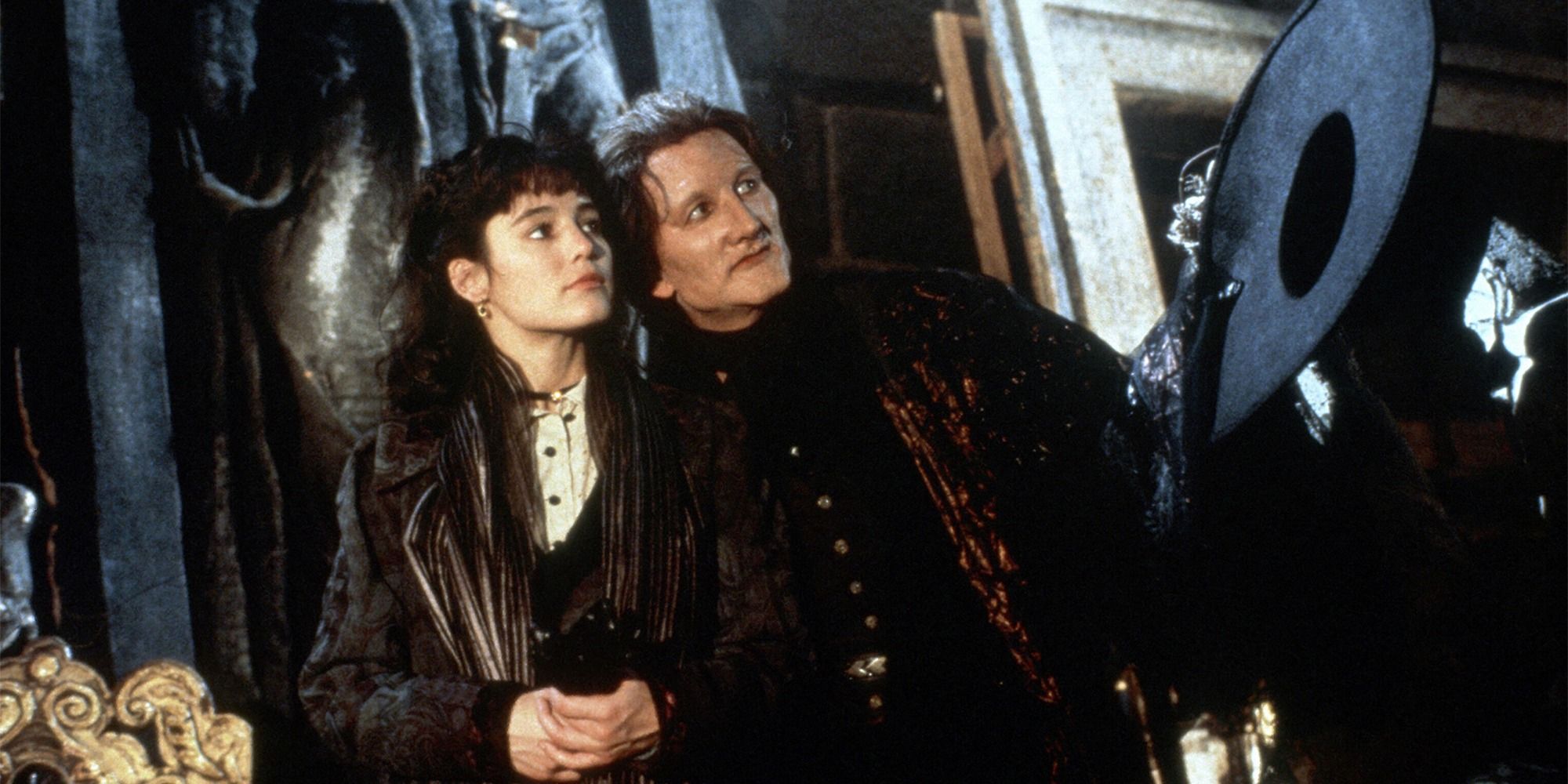 Robert Englund and Jill Schoelen looking at something in 1989 Phantom of the Opera