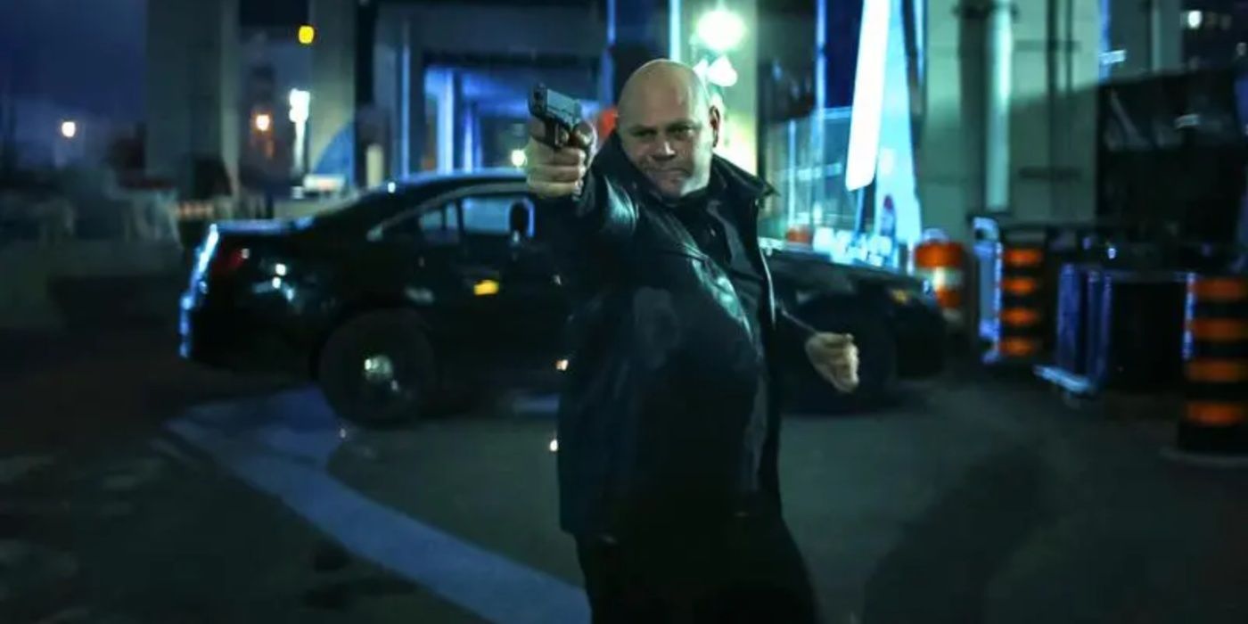 Russo (Domenico Lombardozzi) shooting a gun in Reacher season 2