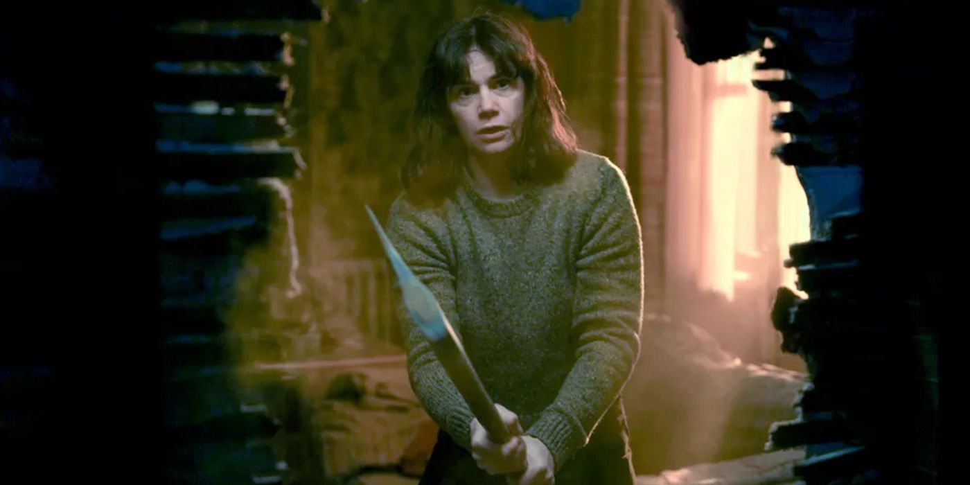 Ruth Wilson's Lorna holding an axe in The Woman in the Wall