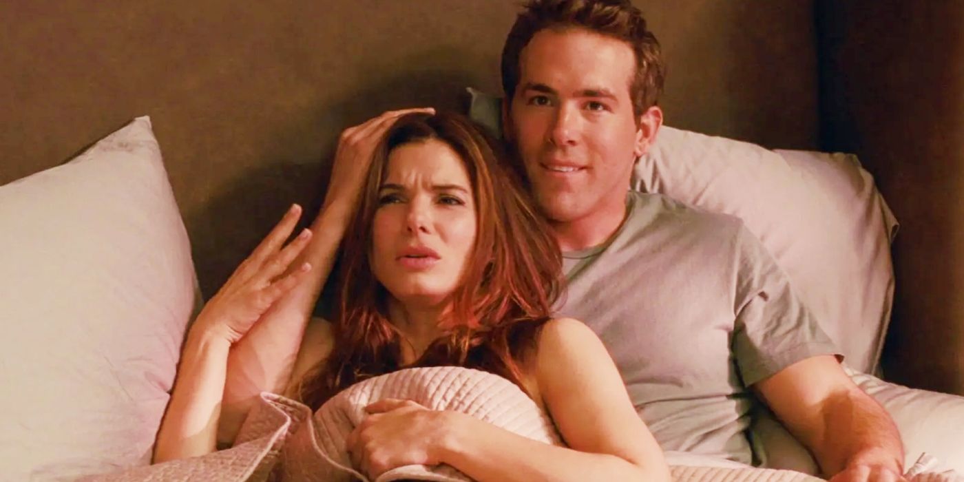 Sandra Bullock and Ryan Reynolds lying in bed together in The Proposal