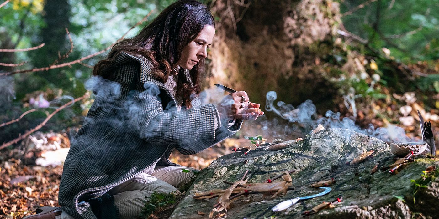 sarah sitting in a forest in sanctuary a witch's tale