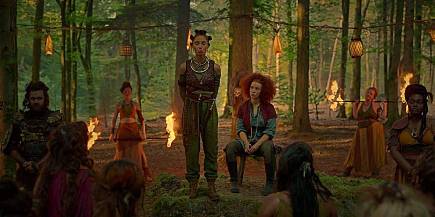 Scorpia (Adwoa Aboah) e Jade (Erin Kellyman) conversando com os Bone Reavers em uma clareira no episódio 5 de Willow.