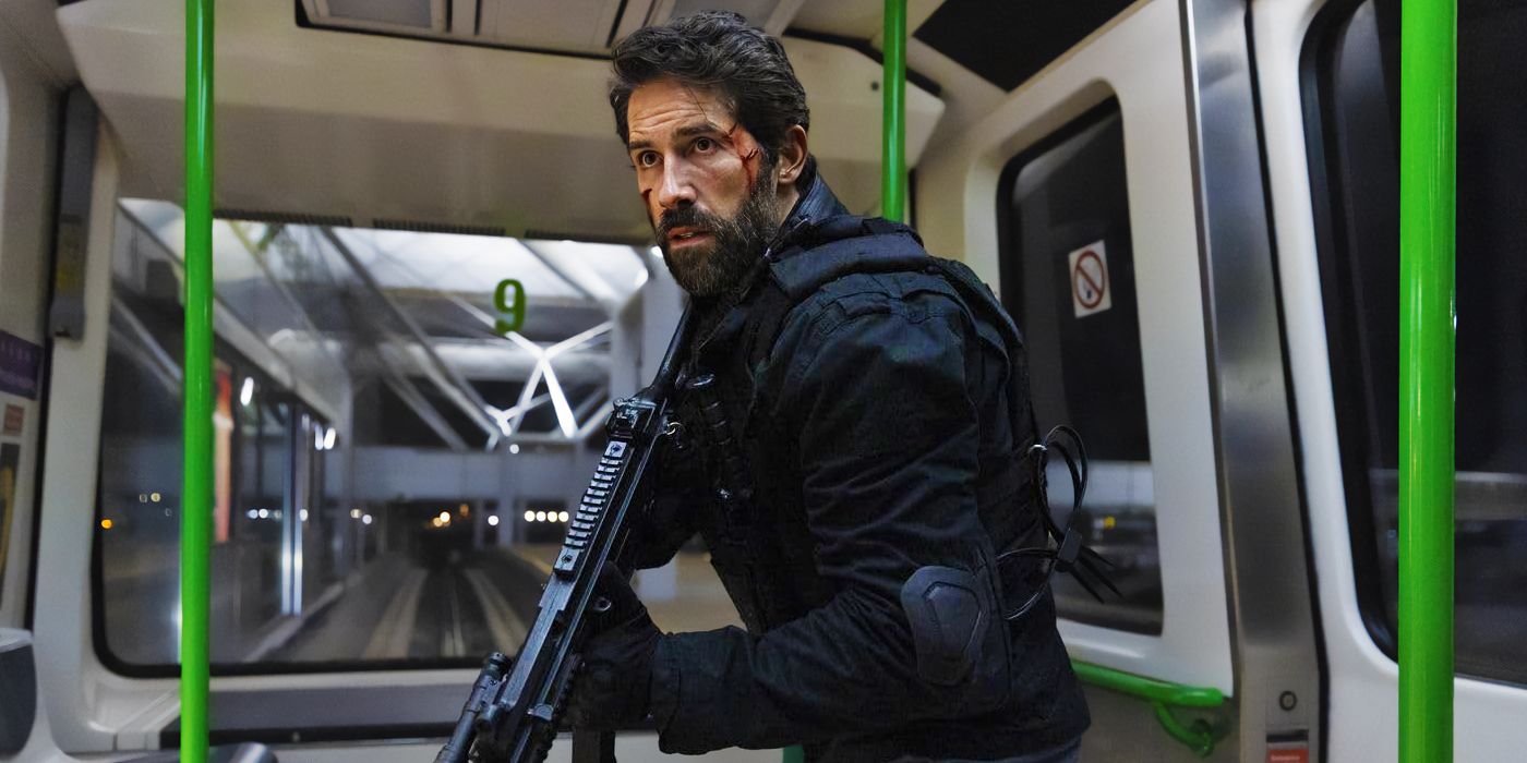 Scott Adkins as Jake Harris on a bus holding a large automatic gun in One More Shot 2024