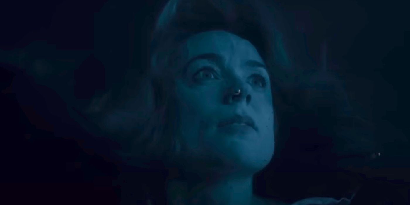 Kerry Condon as Eve Waller underwater looking scared in Night Swim.