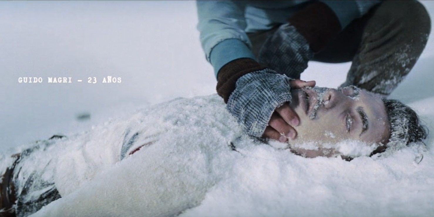 The body of Guido Magri (Julian Bedino) is discovered in the snow in Society of the Snow.