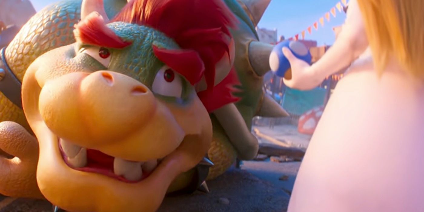 Peach holding a mini mushroom in front of Bowser in The Super Mario Bros Movie.
