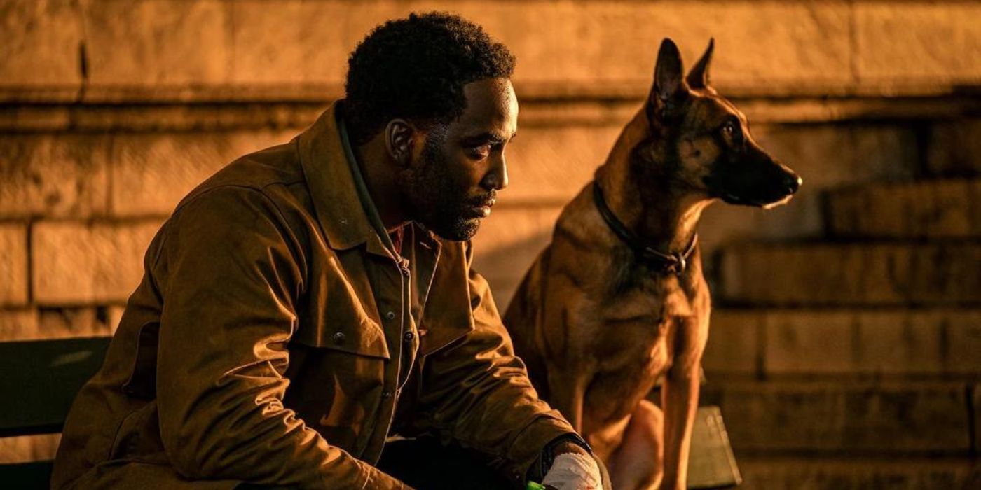 Shamier Anderson as Mr. Nobody sits on a bench next to The Accomplice in John Wick: Chapter 4.