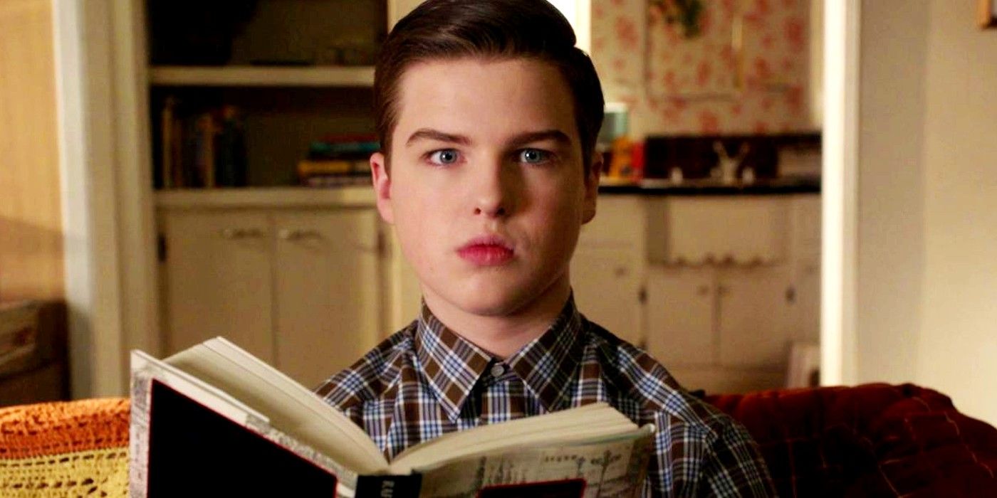Sheldon looking shocked while reading a book in Young Sheldon season 6