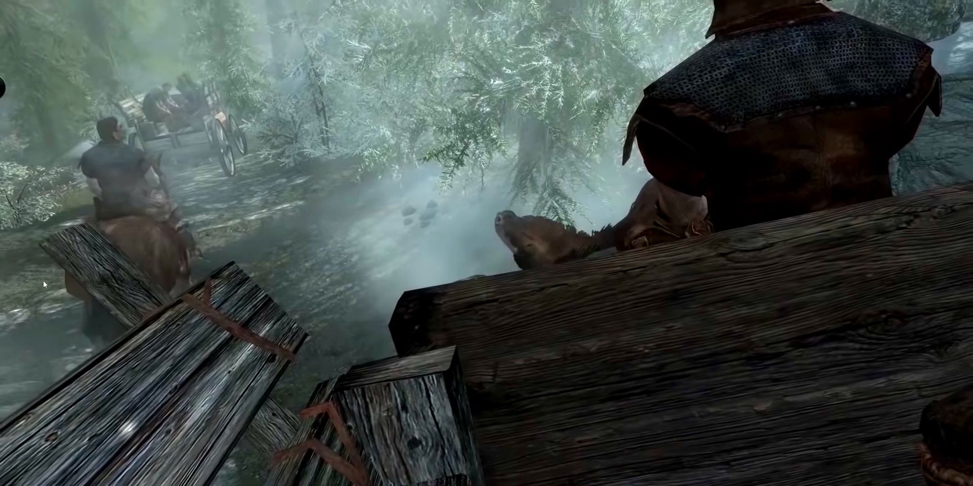 Skyrim opening scene with the rest of the convoy carrying on as the player carriage is stuck because the horse is partially in the ground and sideways