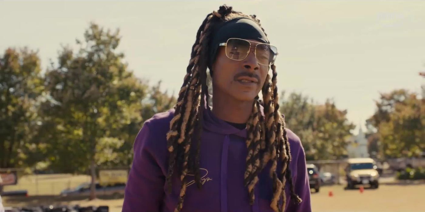 Snoop Dogg as Jaycen JJ Jennings looks across the field in The Underdoggs.