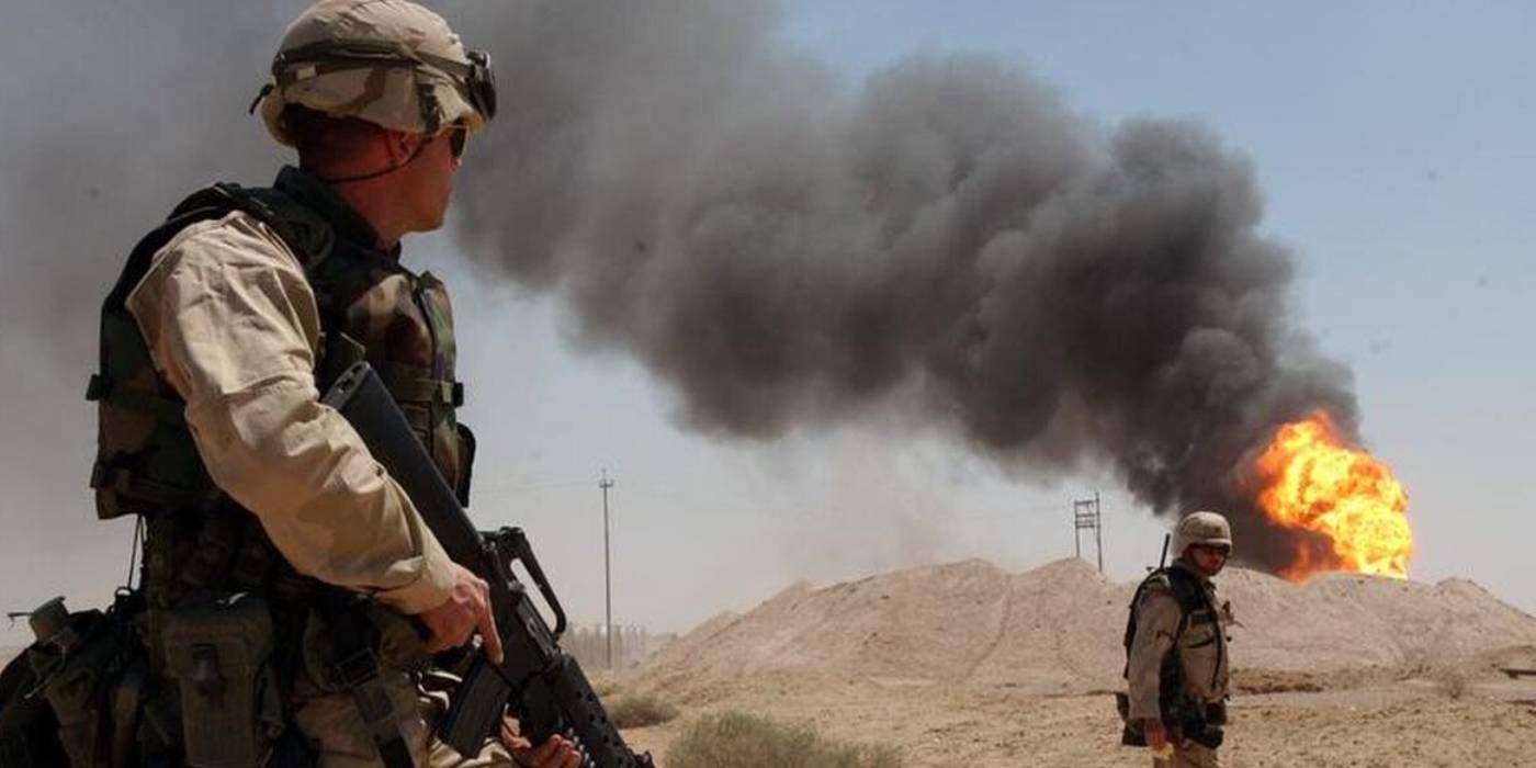 Soldiers look at fire in Gulf War