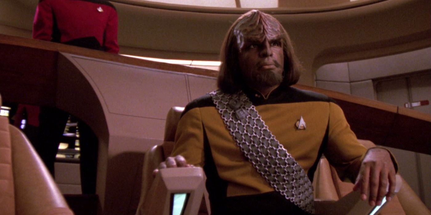 Image of Worf sitting in the captain's chair on the bridge of the Enterprise.