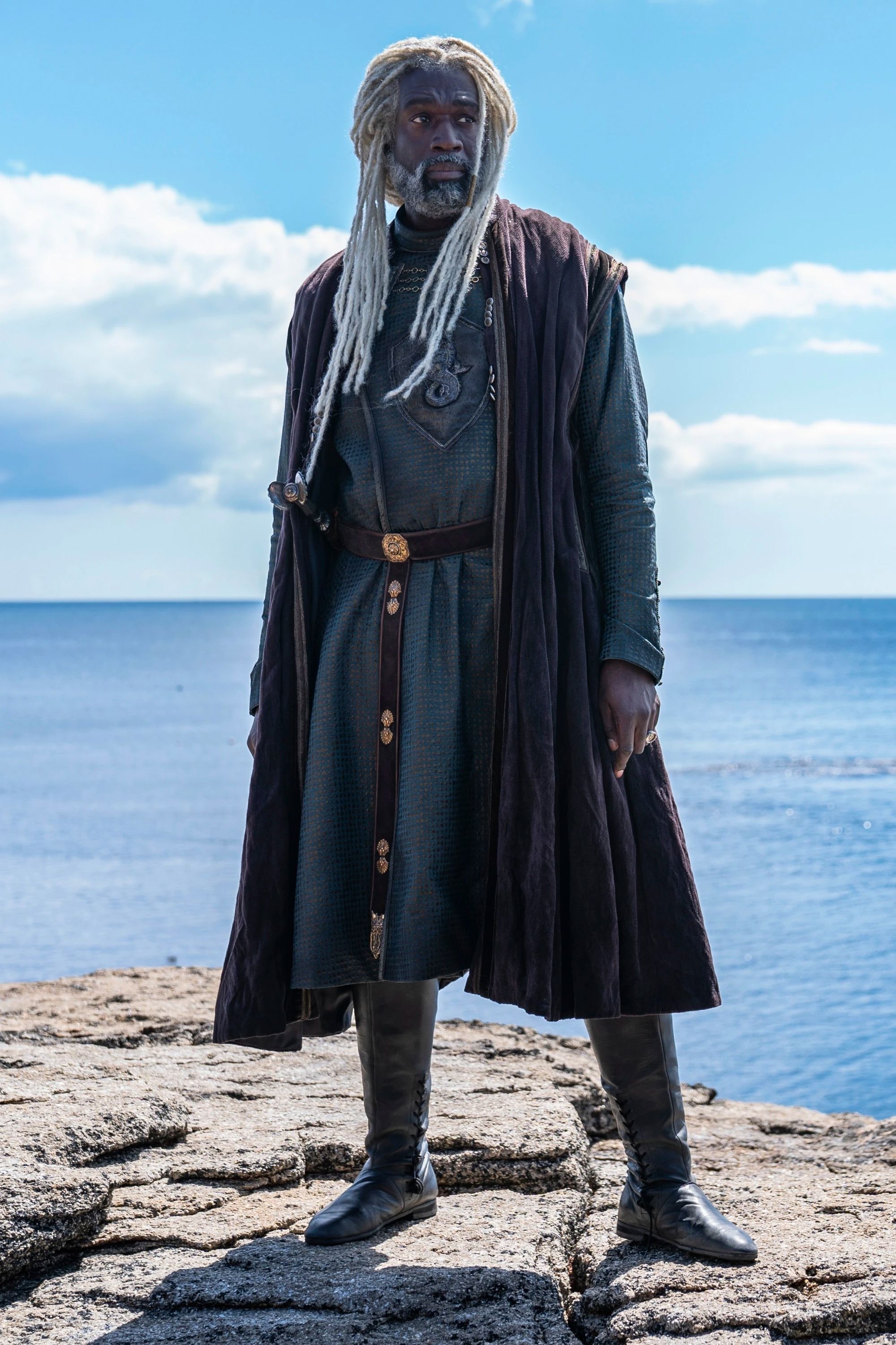 Steve Toussaint as Corlys Velaryon from House of the Dragon Standing on the Edge of a Cliff