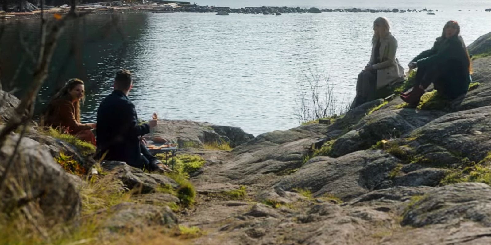 Margo, Alice, Josh, Fen sit on the cliffs of New Fillory in The Magicians.