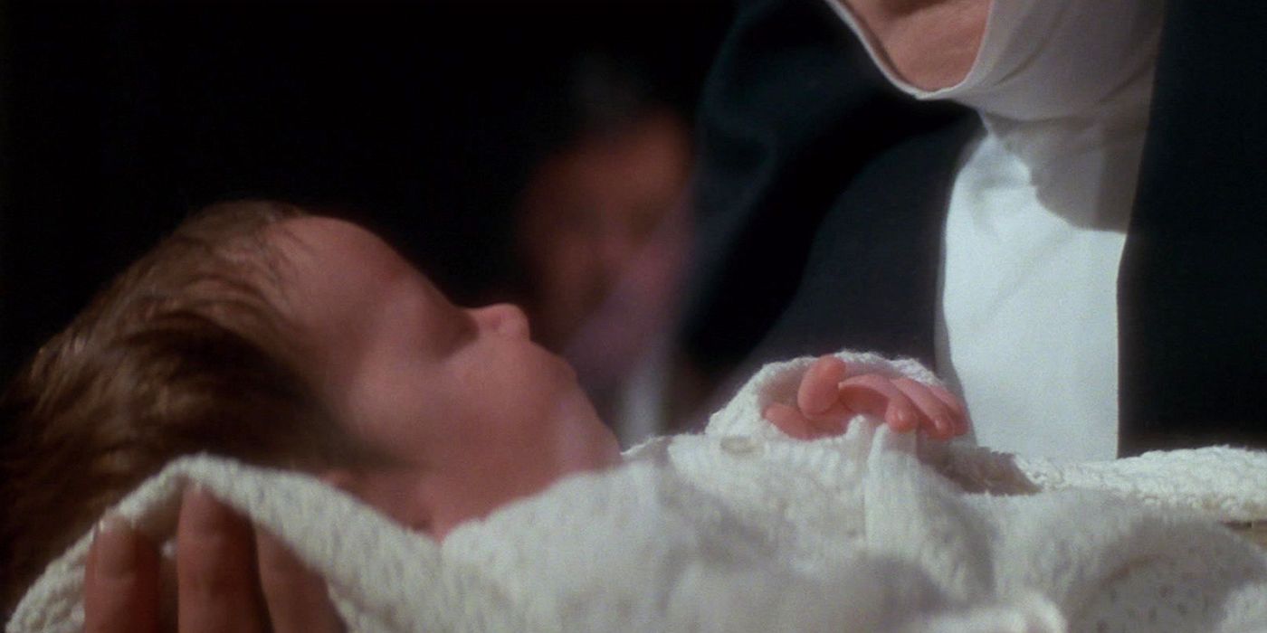 The Omen 1976 baby Damien held by a nun