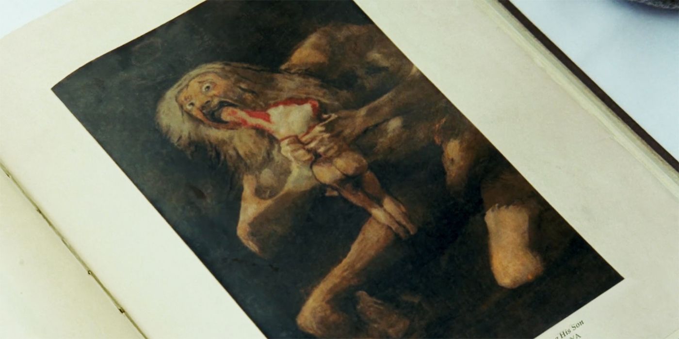 The Postcard Killings book showing Goya's Saturn Devouring His Son