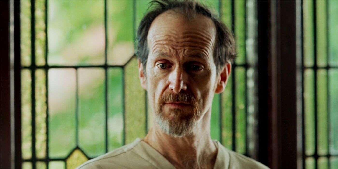 The Postcard Killings Dennis O'Hare as Simon Haysmith Sr in prison