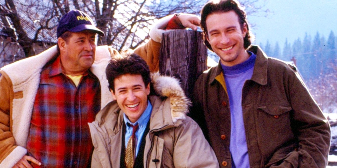 Three characters smiling while in their winter attire in Northern Exposure