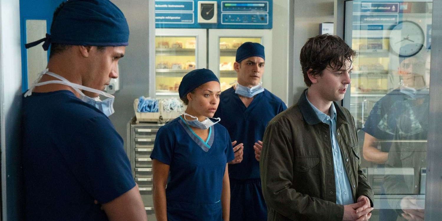 three doctors in scrubs standing behind a wet Shaun Murphy in The Good Doctor