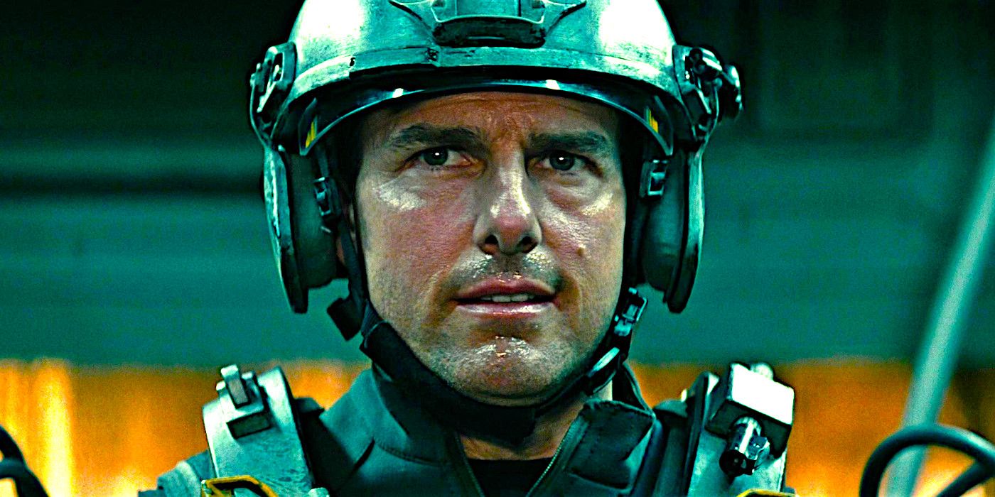 Tom Cruise perspiring while wearing heavy military gear in a scene from Edge of Tomorrow