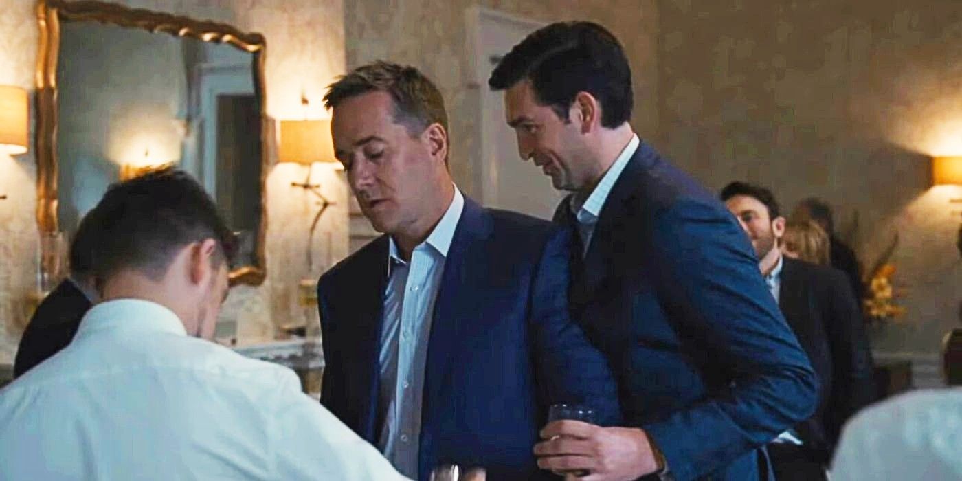 Tom looking tired as Greg gets close giggling about something in Succession season 4