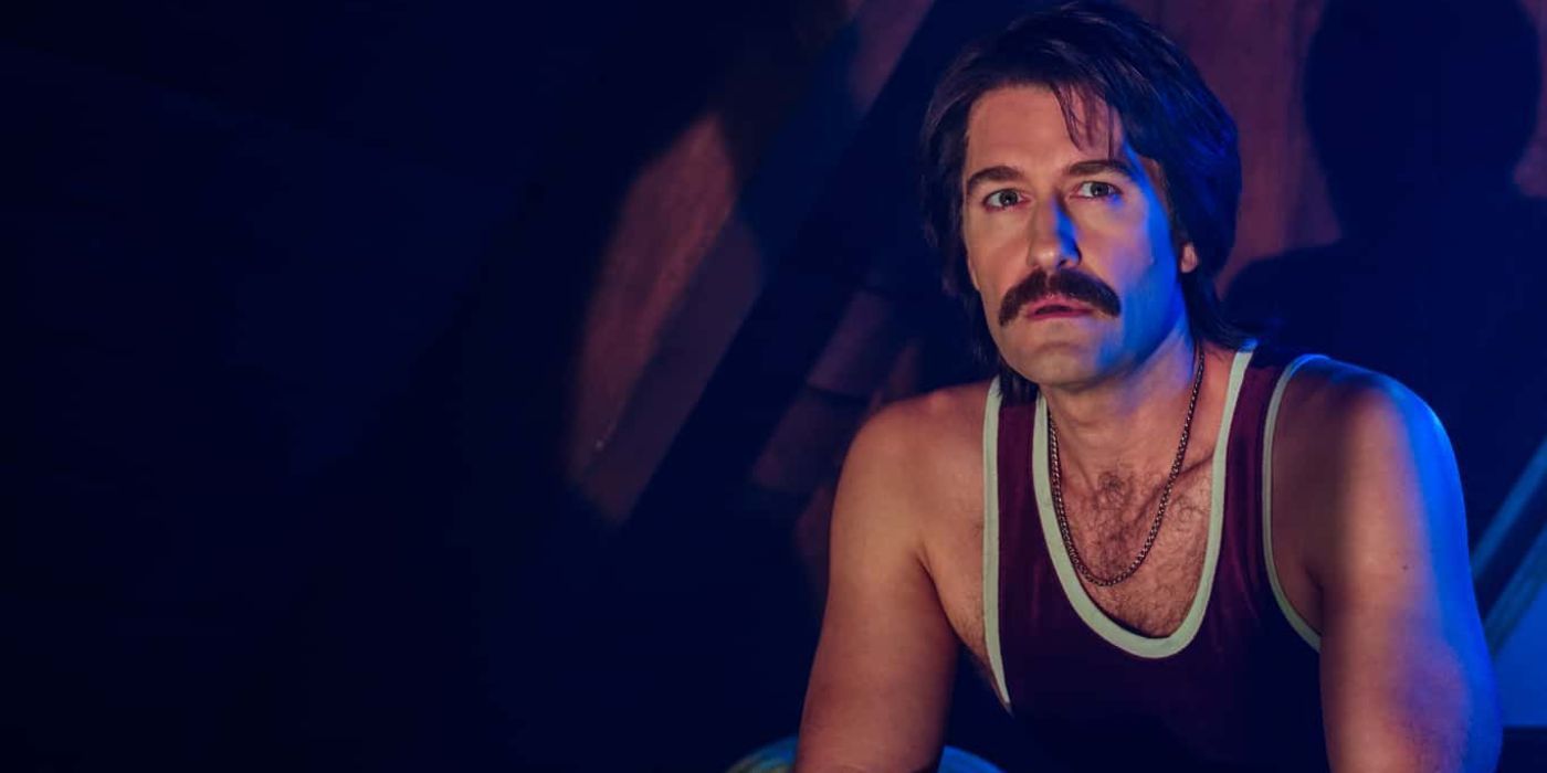 Trevor (Matthew Morrison) fiddling with his hands and looking nervous in AHS 1984.