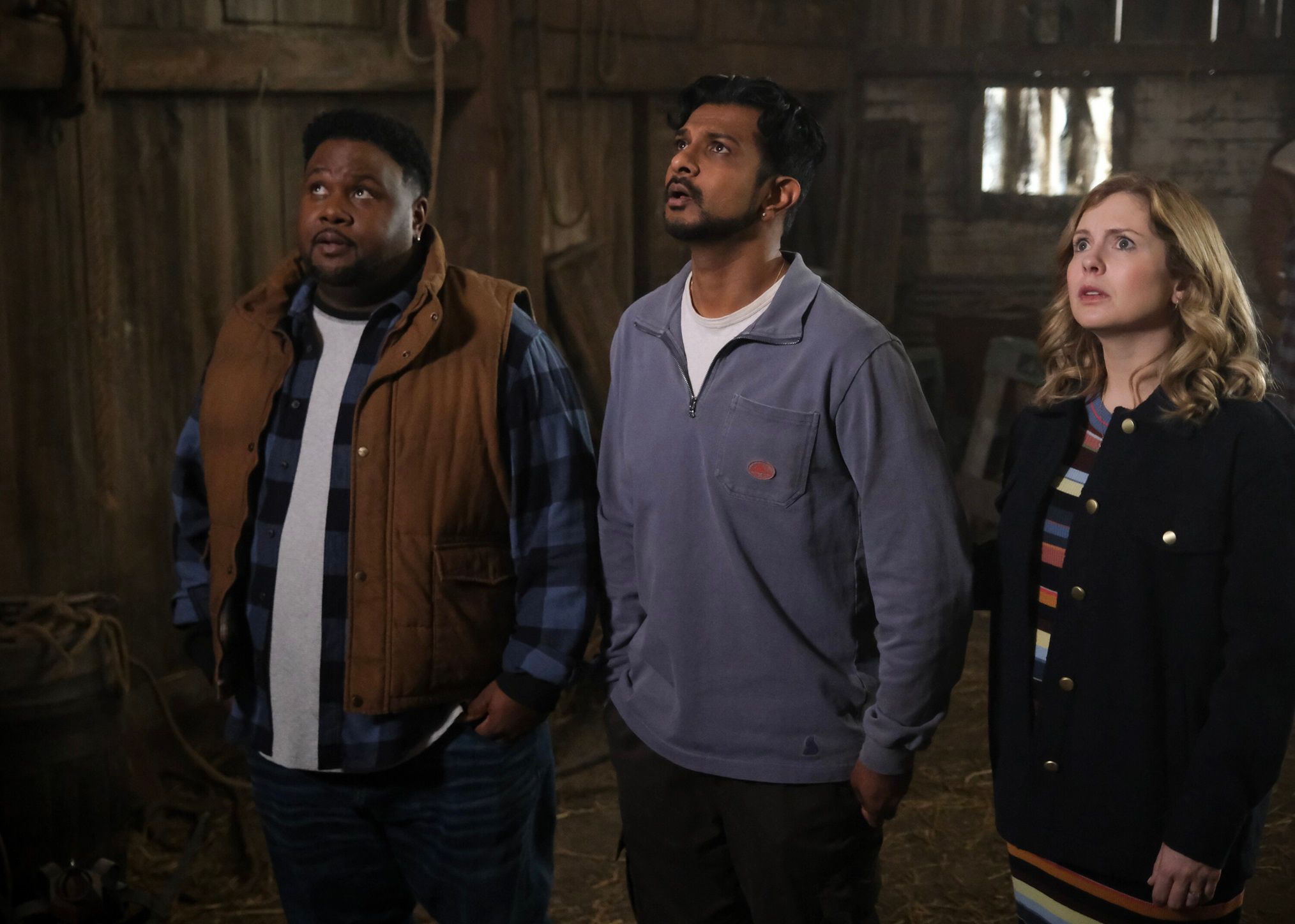 Tristan D Lalla Utkarsh Ambudkar And Rose McIver in looking up to the left in Ghosts season 3