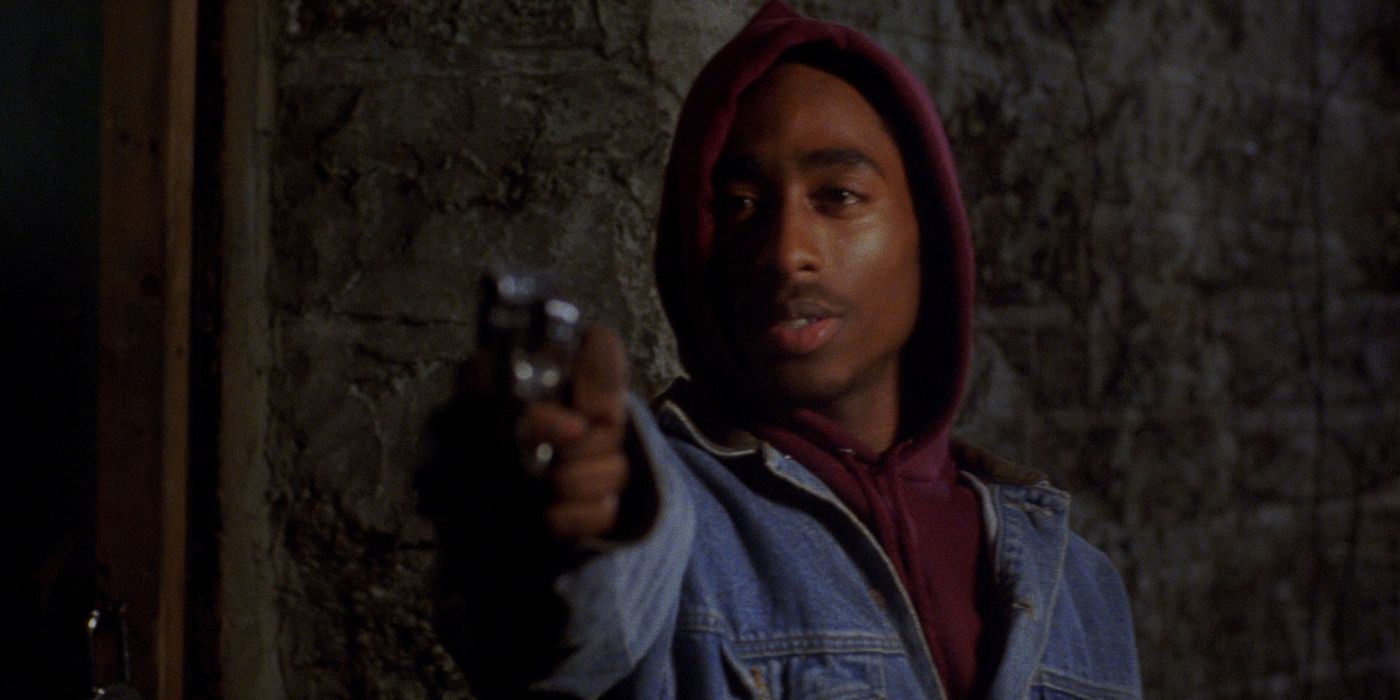 Tupac Shakur as Roland Bishop aims a gun at an off-screen Omar Epps as Quincy Q Powell in Juice.