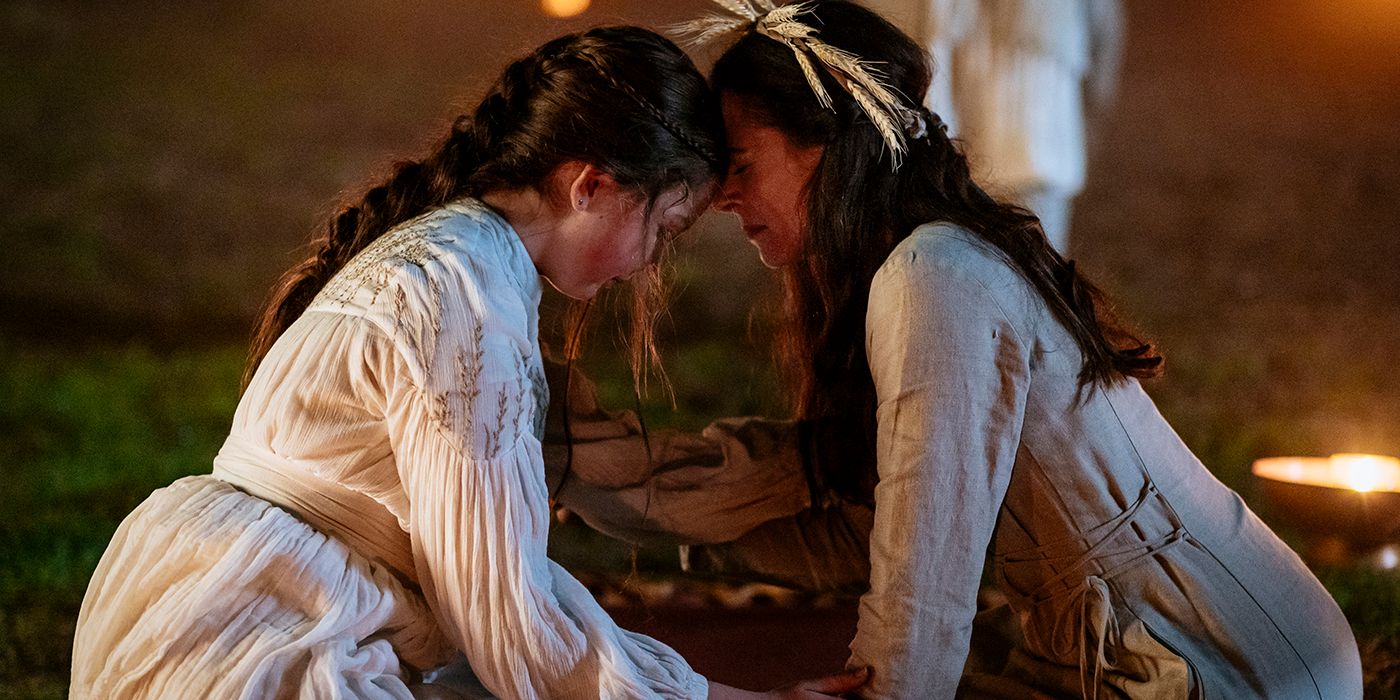 two women touching foreheads in sanctuary a witch's tale