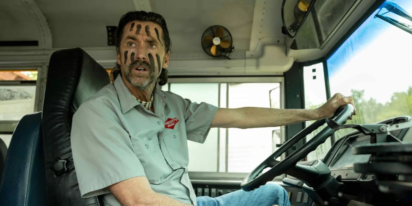 Uncle Kenny (Kirk Fox) sitting in a bus with war paint on in Reservation Dogs.