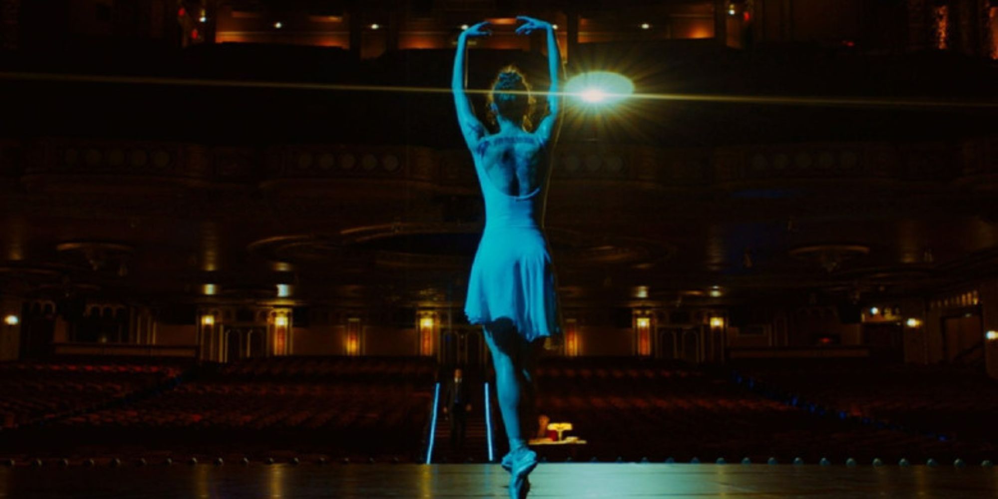 Unity Phelan dances on stage as The Ballerina in John Wick: Chapter 3 - Parabellum.