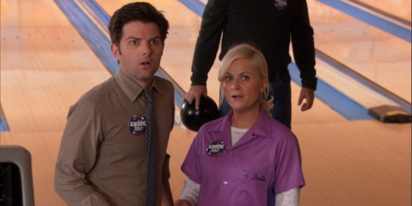 Amy Poehler as Leslie and Adam Scott as Ben looking shocked in Parks and Rec