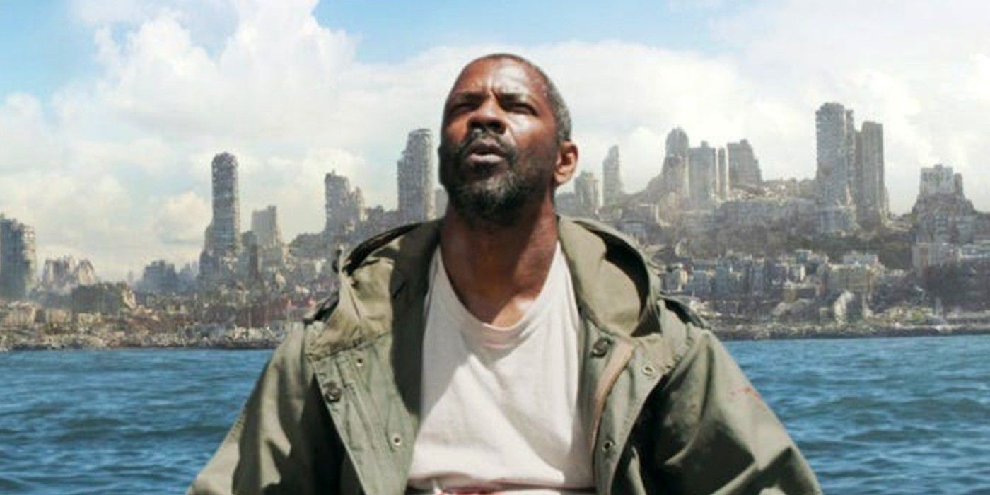 Denzel Washington looking up with a post-apocalyptic city behind him in The Book of Eli