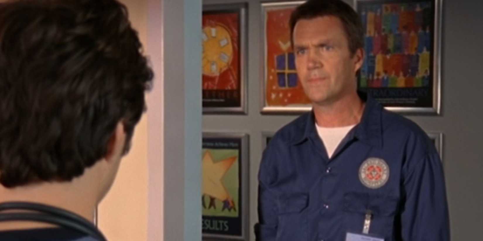 Neil Flynn as the Janitor looking sternly at JD in Scrubs