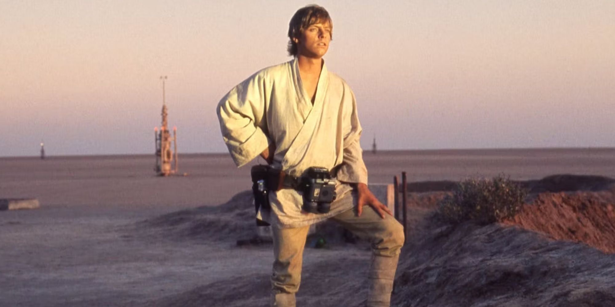 Mark Hamill as Luke Skywalker looking into the distance in Star Wars: Episode IV - A New Hope