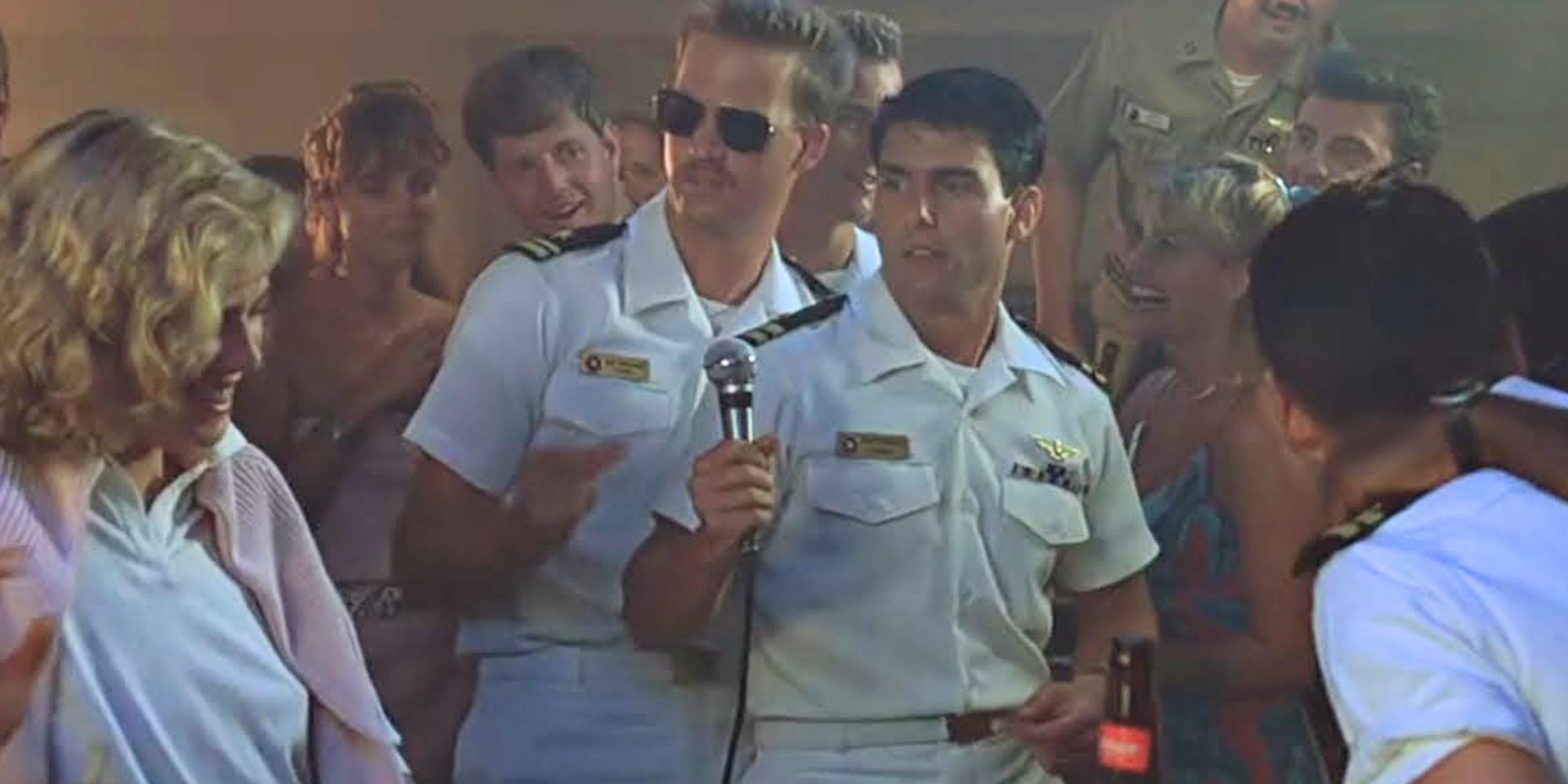 Maverick (Tom Cruise) and Goose (Anthony Edwards) serenading Charlotte in Top Gun