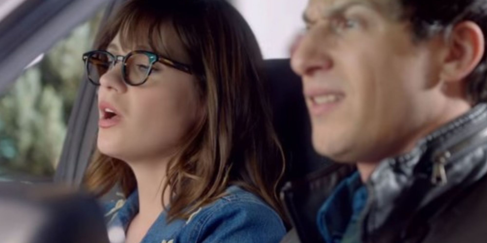 Zooey Deschanel as Jess Day in a car with Andy Samberg as Jake Peralta at Brooklyn Nine-Nine