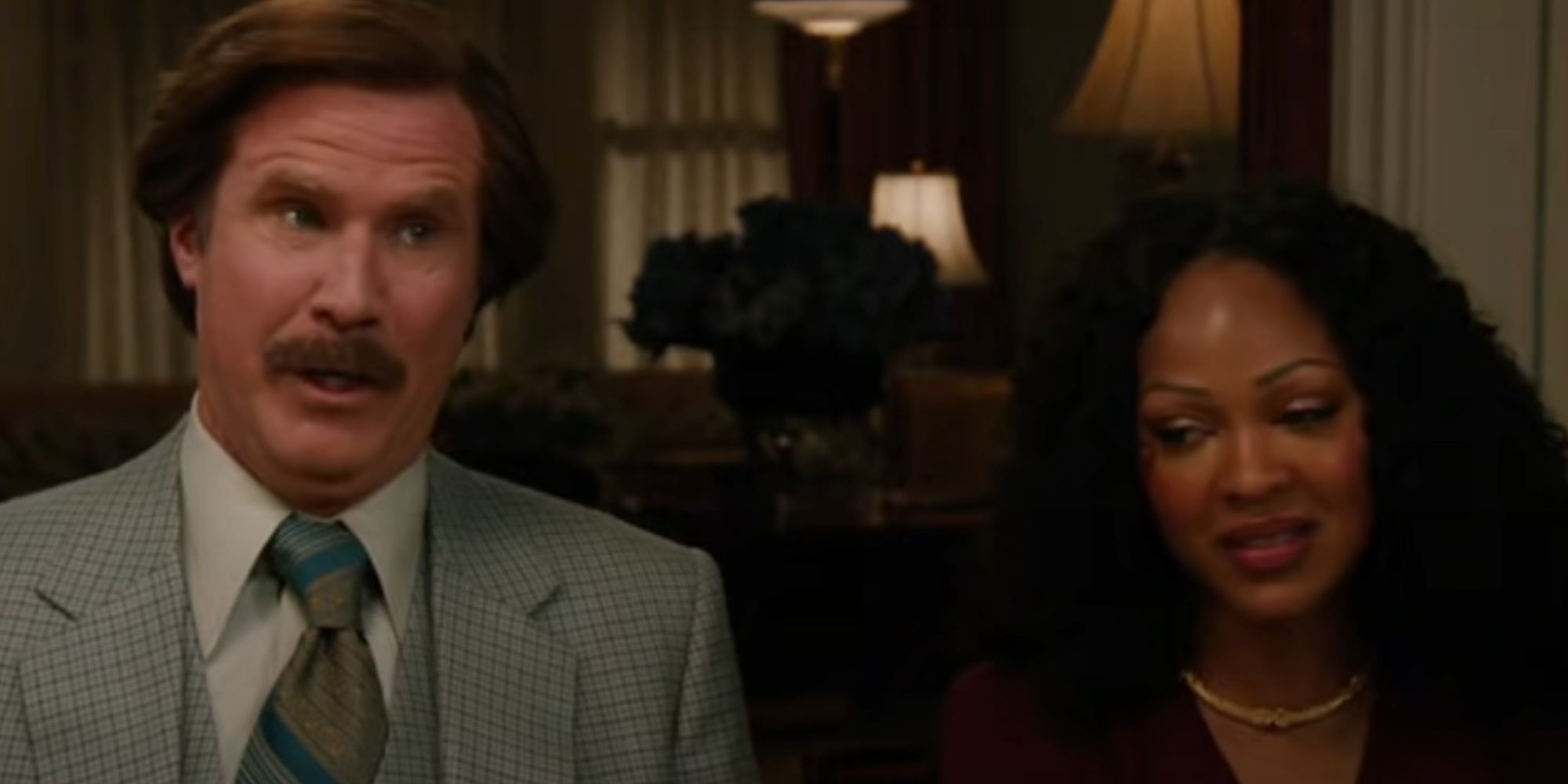 Will Ferrell mid-sentence as Ron Burgundy in Anchorman 2 while Meagan Good looks embarrassed as Linda Jackson 