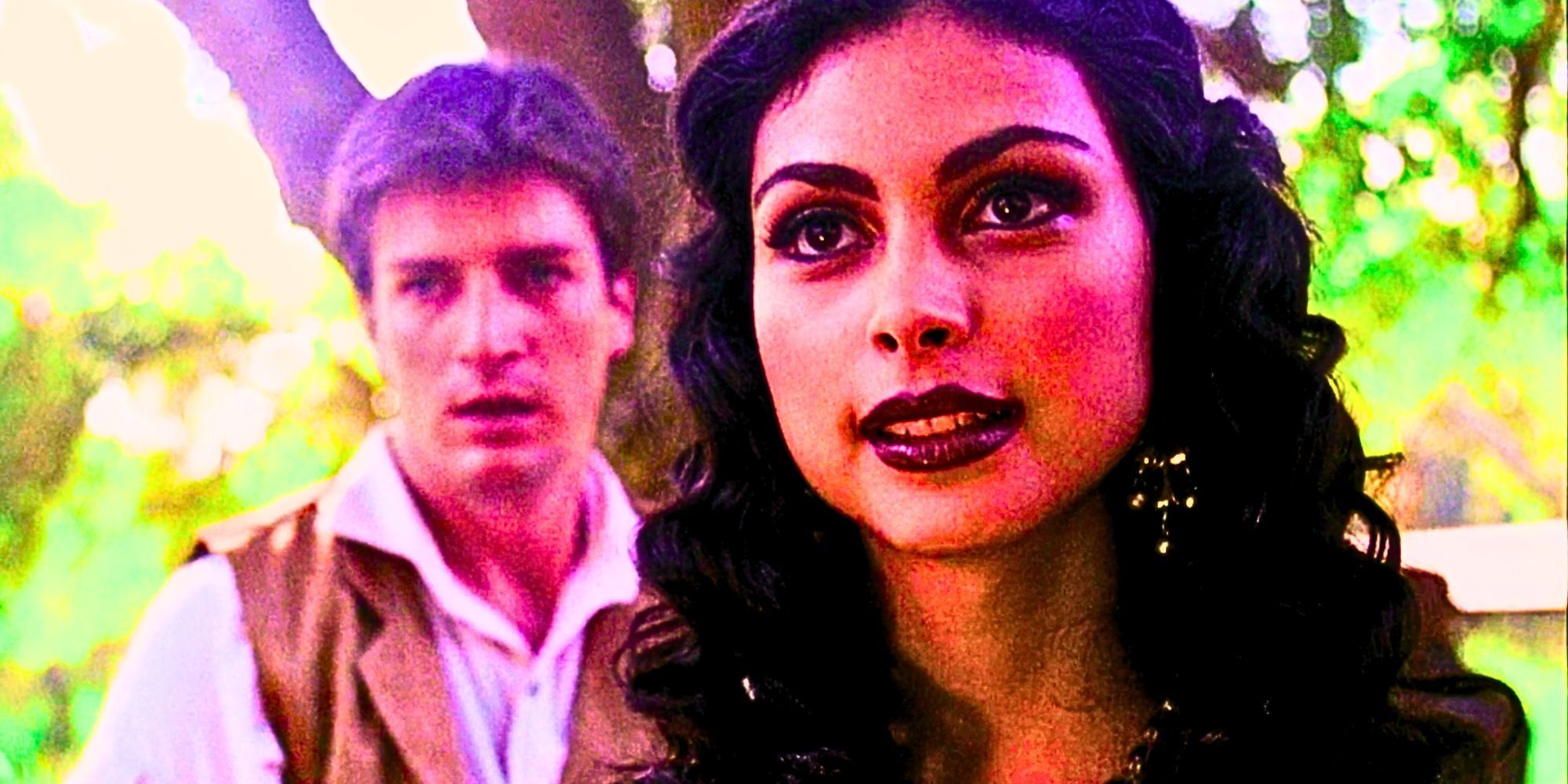 Morena Baccarin as Inara Serra in Firefly in the foreground as Nathan Fillion's Malcolm Reynolds cowers in the background