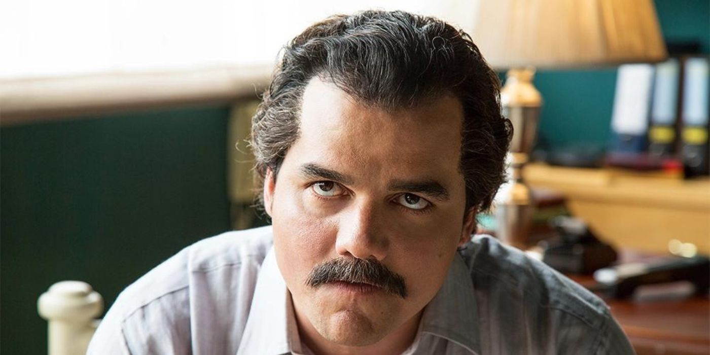 Wagner Moura as Pablo Escobar glares at someone off-screen in a scene from Narcos.