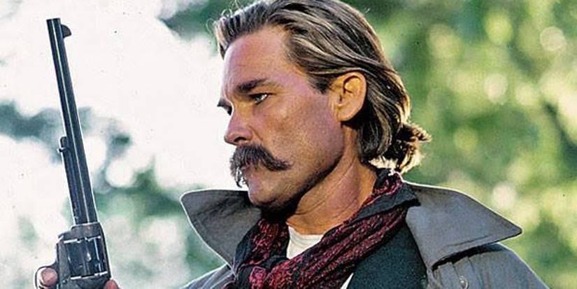 Wyatt Earp holding a gun in Tombstone
