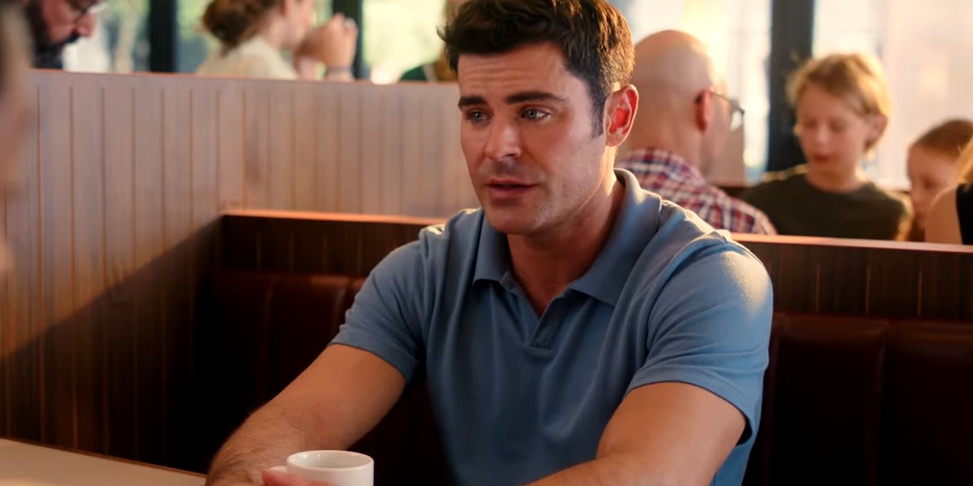 Zac Efron wearing a blue-collared shirt while having a coffee at a diner in Ricky Stanicky