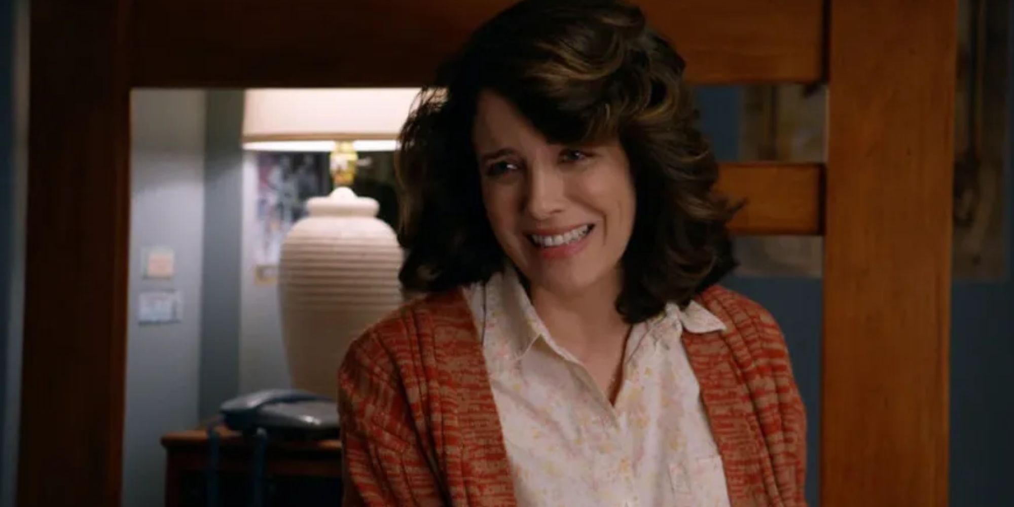 Alanna Ubach as Susan Bennett smiling awkwardly in Ted