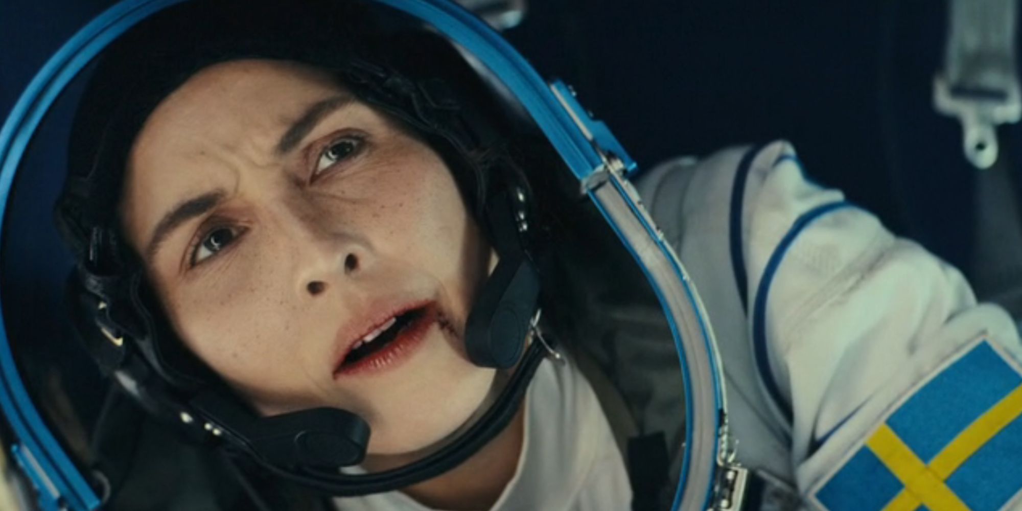 Noomi Rapace as Jo looking confused in a space suit in Constellation - Noomi Rapace's character is left confused by the alterations to her everyday life - How Jo's Current Reality Differs From Her Original Life