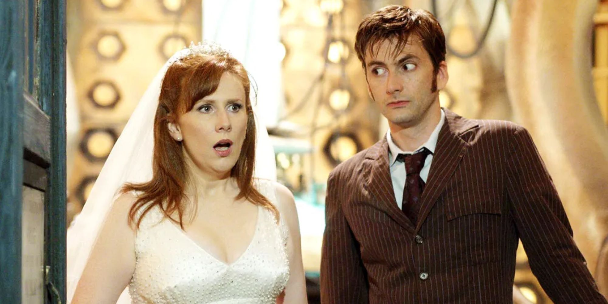 Catherine Tat as Donna Noble wearing a wedding dress in the TARDIS looking shocked as David Tennant's Tenth Doctor watches her react