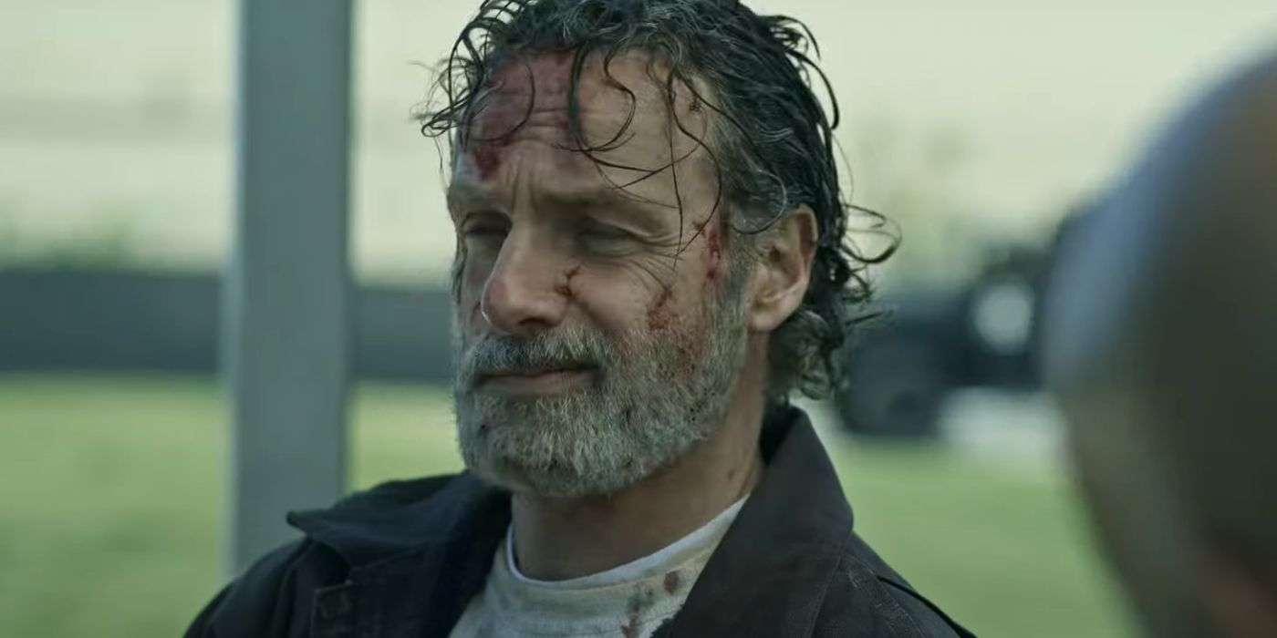 A bloody Rick Grimes (Andrew Lincoln) smirks in The Walking Dead - The Ones Who Live