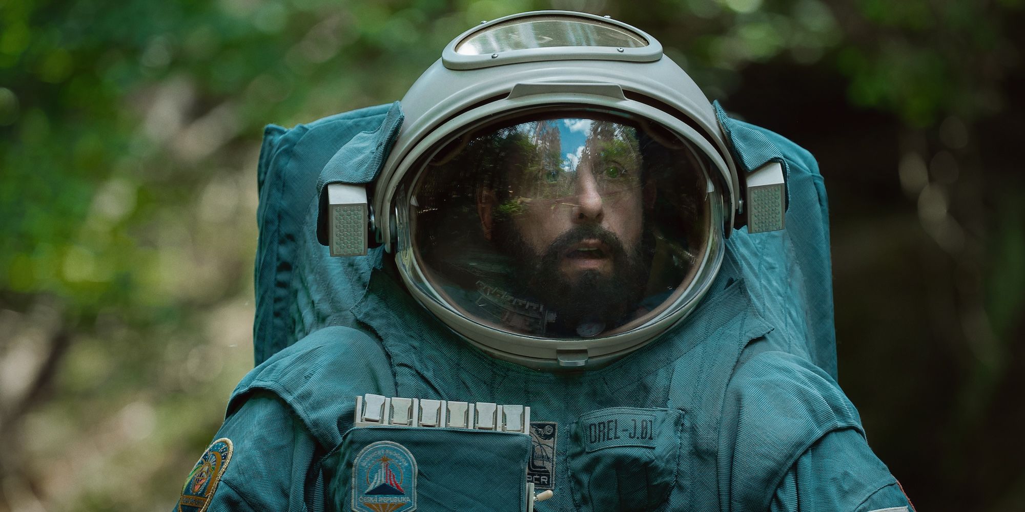 Adam Sandler wears an astronaut suit in Spaceman