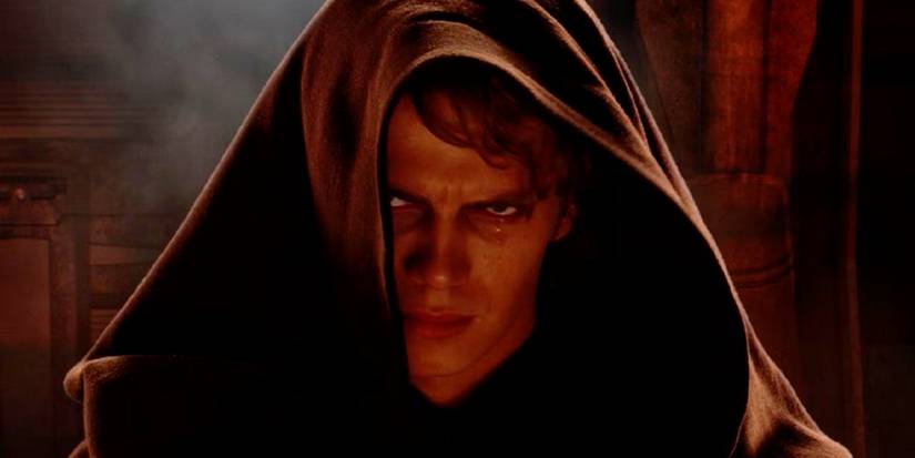Anakin Skywalker staring at the camera with a hood on and an angry look on his face right after he agreed to become Palpatine's apprentice in Star Wars Episode III Revenge of the Sith