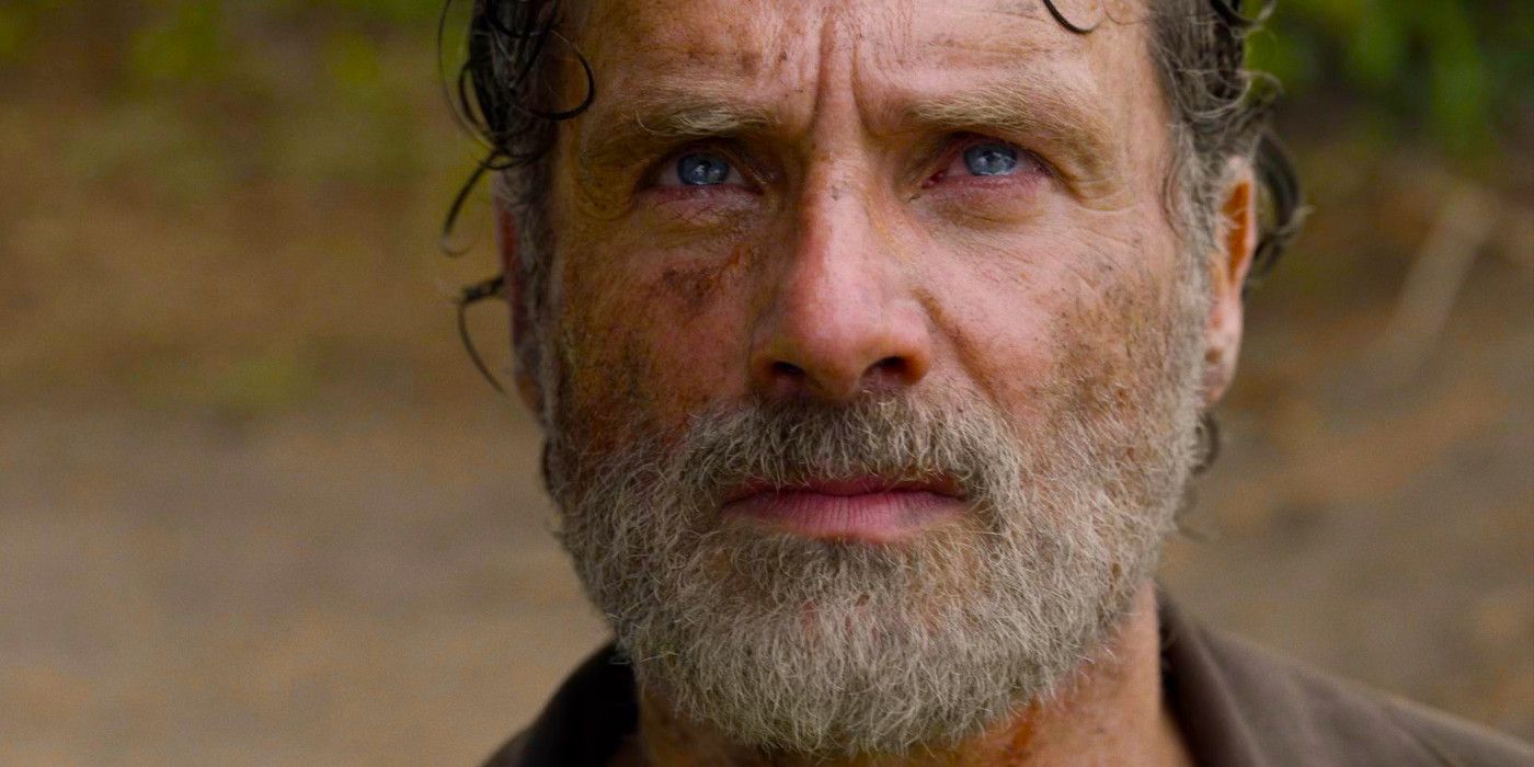 Andrew Lincoln as Rick Grimes gazing upward with tears in his eyes in The Walking Dead