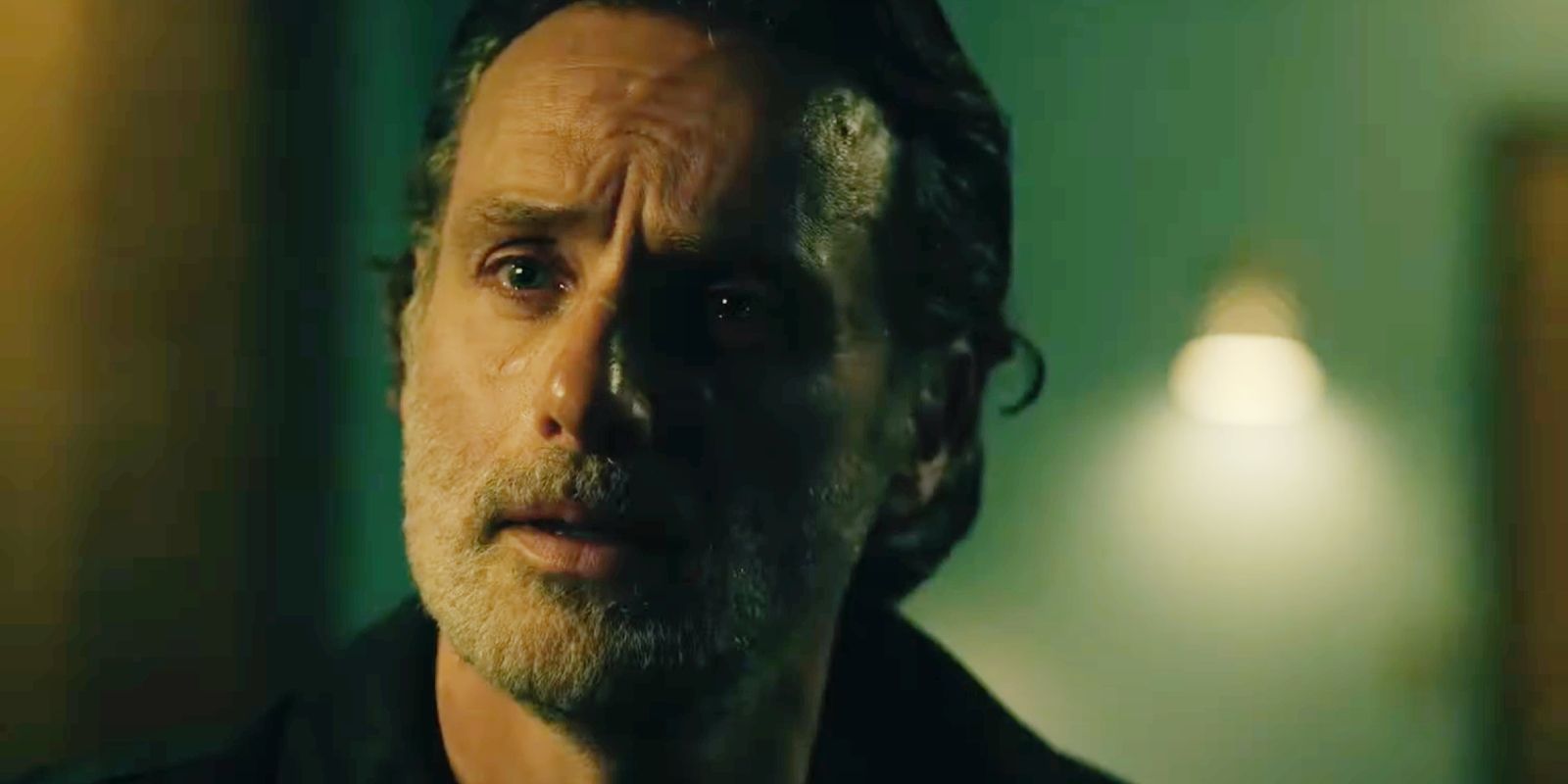 Andrew Lincoln with tears in his eyes as Rick in The Walking Dead: The Ones Who Live.